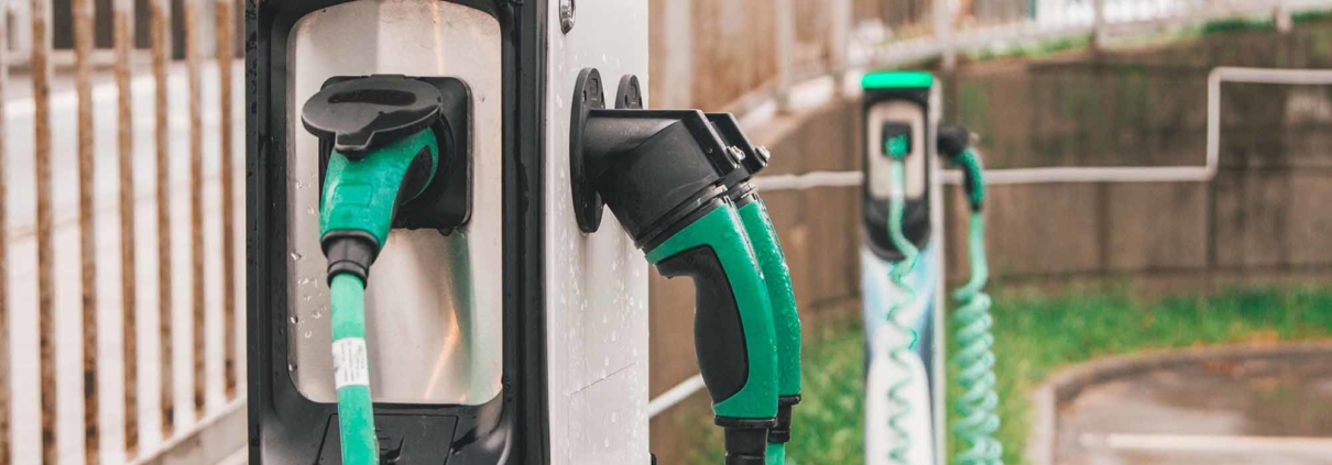 Close up of green and black EV charging stations