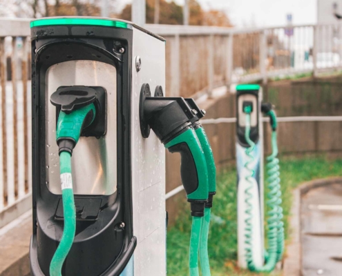 Close up of green and black EV charging stations